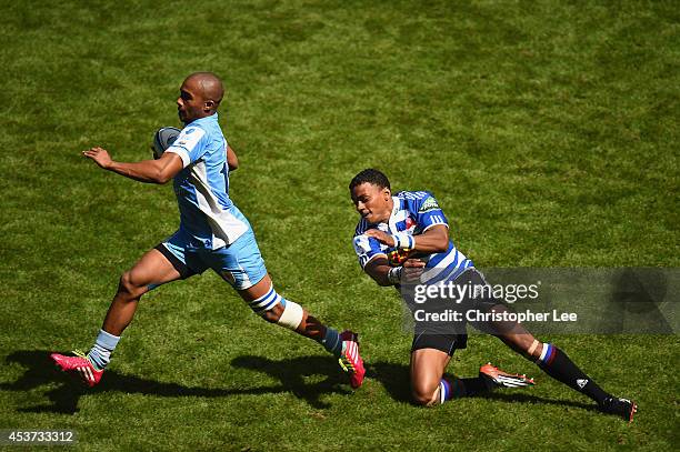 Leroy Bitterhout of Blue Bulls gets away from Lalakai Foketi of Waratahs to score a try during the Cup Quarter Final Match between Vodacom Blue Bulls...