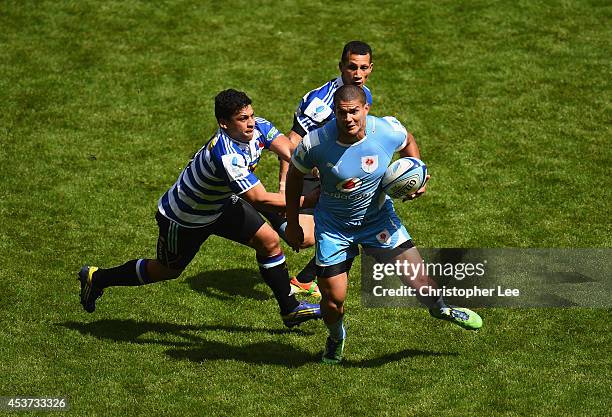 Clayton Stewart of Blue Bulls is held back by Brendan McKibbin of Waratahs during the Cup Quarter Final Match between Vodacom Blue Bulls and NSW...