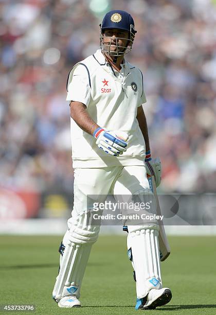 Mahendra Singh Dhoni of India leaves the field after being dismissed by Chris Woakes of England during day three of 5th Investec Test match between...