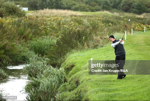 Rowan Lester of Ireland plays an approach shot in his match play final against Oskar Bergqvist of Sweden during the Boys Amateur Championship at...