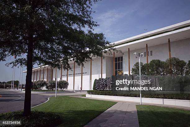 Pedestrians walk up a sidewalk to the John F. Kennedy Center for the Performing Arts on August 16, 2014 in Washington, DC. The building opened on...
