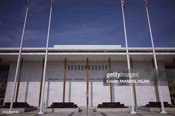 Pedestrians walk up a sidewalk to the John F. Kennedy Center for the Performing Arts on August 16, 2014 in Washington, DC. The building opened on...