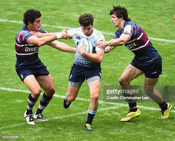 Owen Jenkins of Cardiff battles with Francisco Merello and Nicolas Menendez of Buenos Aires during the Cup Quarter Final match between Buenos Aires...