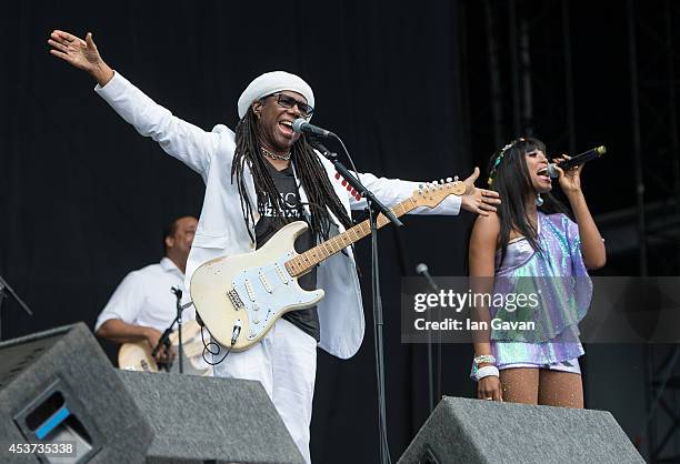 Nile Rodgers and Folami Ankoanda-Thompson of 'Chic' performs on the Virgin Media during Day 2 of the V Festival at Hylands Park on August 17, 2014 in...