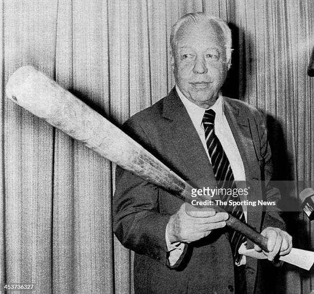 American League President Lee MacPhail, holding George Brett's "pine tar" bat, overrules his umpires on July 28, 1983 and upholds a protest by the...