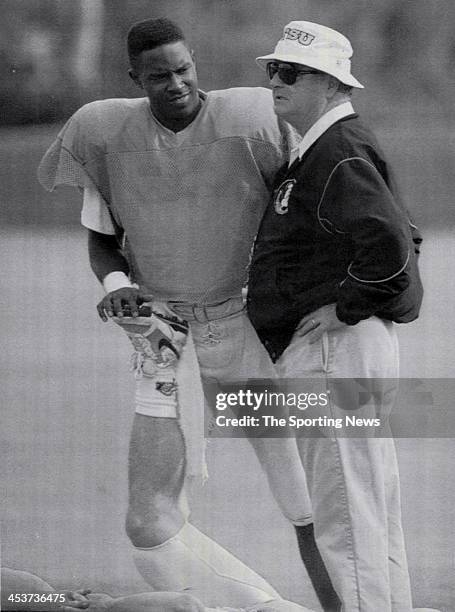 Florida State Seminoles quarterback Charlie Ward talks with head coach Bobby Bowden prior to the start of practice Sunday at the University of Miami...