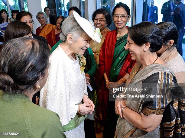 Japan's Empress Michiko speaks with the members of the International Board on Books for Young People on December 3, 2013 in New Delhi, India. The...