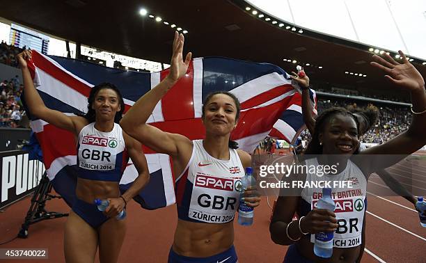 Great Britain's Ashleigh Nelson, Great Britain's Jodie Williams, Great Britain's Asha Philip and Great Britain's Desiree Henry, holding their...
