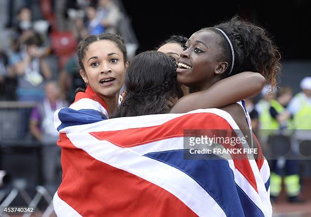 Great Britain's Jodie Williams, Great Britain's Asha Philip, Great Britain's Ashleigh Nelson and Great Britain's Desiree Henry, draped in their...