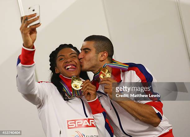 Adam Gemili andAshleigh Nelson of Great Britain take a selfie after winning Gold in the Mens and Womens 4x100m relay during day six of the 22nd...