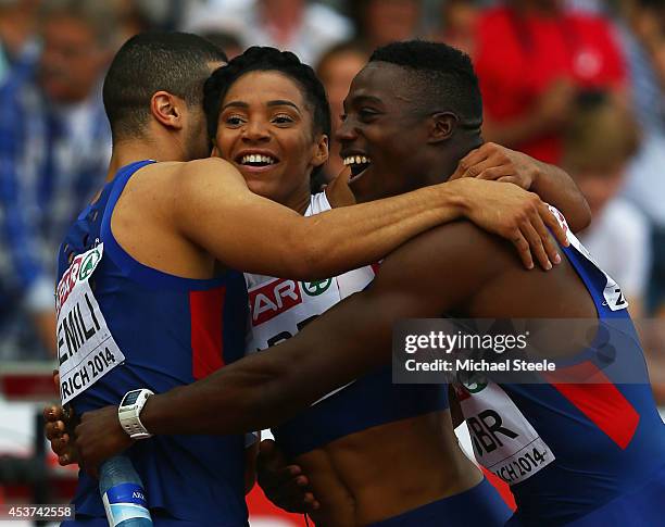 Harry Aikines-Aryeetey and Adam Gemili of Great Britain and Northern Ireland celebrate with Ashleigh Nelson of Great Britain and Northern Ireland...