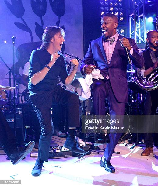 Paul McCartney and Jamie Foxx dance onstage at Apollo in the Hamptons at The Creeks on August 16, 2014 in East Hampton, New York.