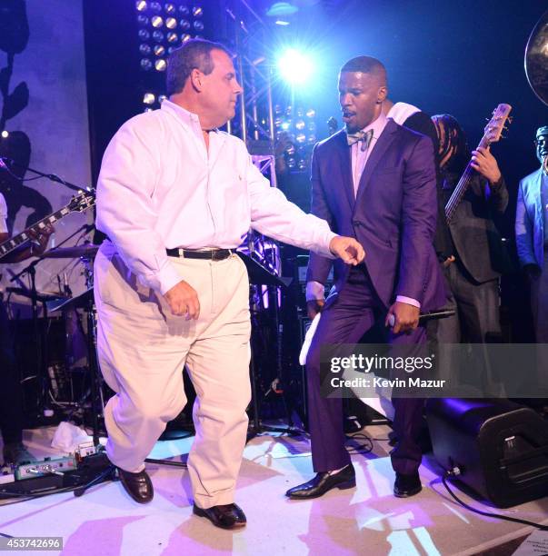 New Jersey Governor Chris Christie dances onstage with Jamie Foxx at Apollo in the Hamptons at The Creeks on August 16, 2014 in East Hampton, New...