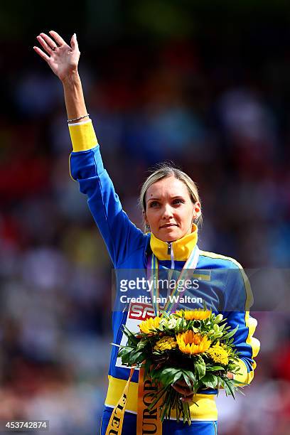 Gold medalist Olha Saladukha of Ukraine stands on the podium during the medal ceremony for the Women's Triple Jump final during day six of the 22nd...