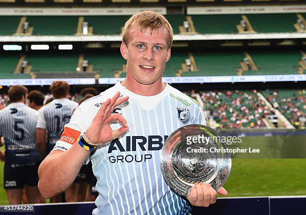 Captain Jevon Groves of Cardiff Blues poses for the camera with the Plate Trophy during the Plate Trophy Final match between Cardiff Blues and...