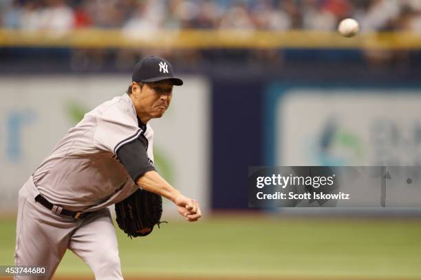 Hiroki Kuroda of the New York Yankees pitches during the first inning against the Tampa Bay Rays at Tropicana Field on August 17, 2014 in St...