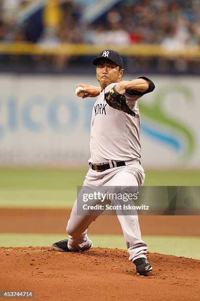 Hiroki Kuroda of the New York Yankees pitches during the first inning against the Tampa Bay Rays at Tropicana Field on August 17, 2014 in St...