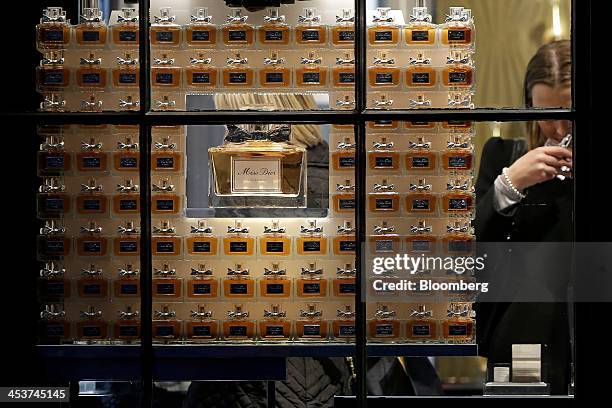 Customers sample Miss Dior perfumes inside a Dior store, operated by Christian Dior SA, in London, U.K., on Wednesday, Dec. 4, 2013. The U.K. Economy...