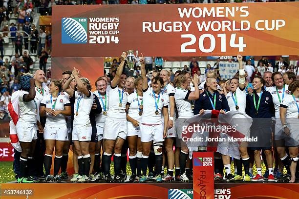 England Captain Katy Mclean and Sarah Hunter hold the trophy after England win the IRB Women's Rugby World Cup 2014 Final between England and Canada...