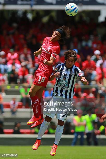 Jurgen Damm of Pachuca struggles for the ball with Carlos Orrantia of Toluca during a match between Toluca and Pachuca as part of 5th round Apertura...