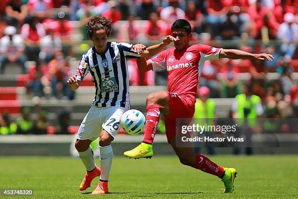Simon Almeida of Pachuca struggles for the ball with Francisco Gamboa of Toluca during a match between Toluca and Pachuca as part of 5th round...