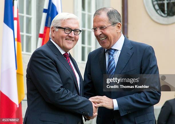 German Foreign Minister Frank-Walter Steinmeier greets Russian Foreign Minister Sergey Lavrov prior to talks with French Foreign Minister Laurent...