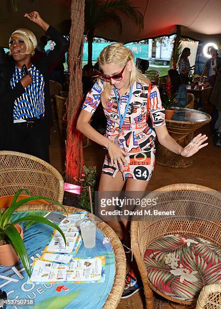 Pixie Lott attends the Mahiki Rum Bar for the launch of the Mahiki Rum Family backstage during day 2 of the V Festival 2014 at Hylands Park on August...