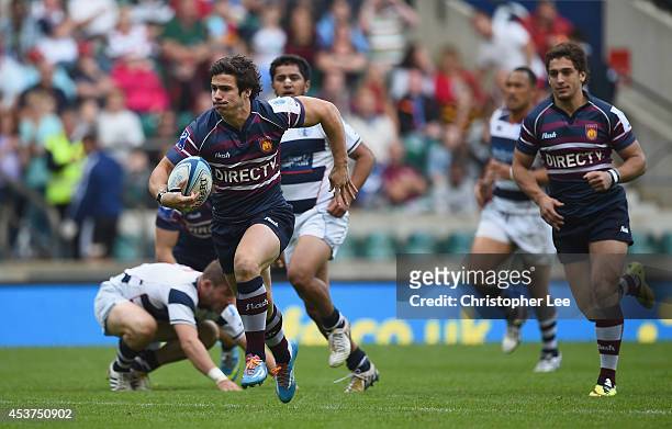 Rodrigo Etchart of Buenos Aires breaks away from the Auckland defence to score a try during the Cup Final match between Buenos Aires and Auckland...