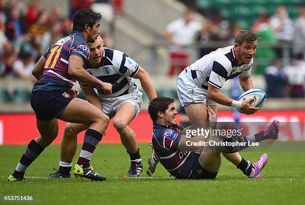 Mitch Hunt of Auckland is tackled by Bautista Guemes of Buenos Aires during the Cup Final match between Buenos Aires and Auckland during the World...