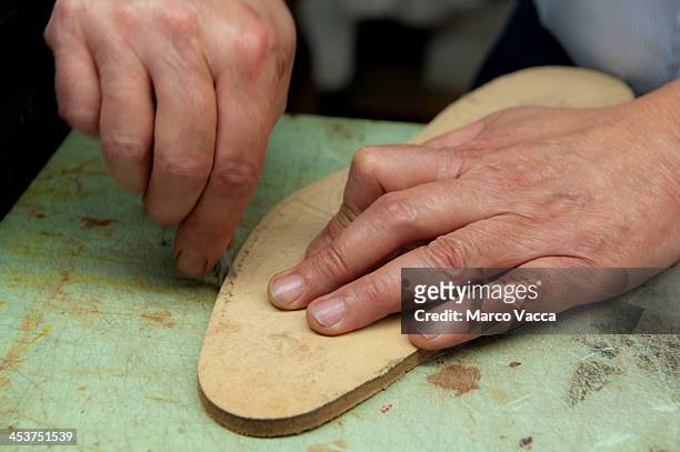 hands of a cobbler - scarpe stock pictures, royalty-free photos & images