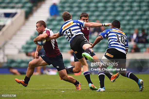 Vladimir Ostroushko of Kuban Krasnodar gets away from Josh Holmes and Dave Horwitz of Waratahs during the 3rd / 4th Place match between Kuban...