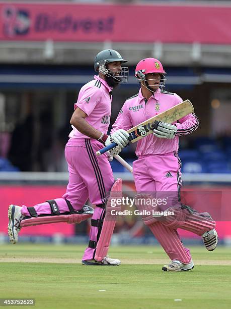 Hashim Amla and Quinton de Kock of South Africa in action during the 1st Momentum ODI match between South Africa and India at Bidvest Wanderers...