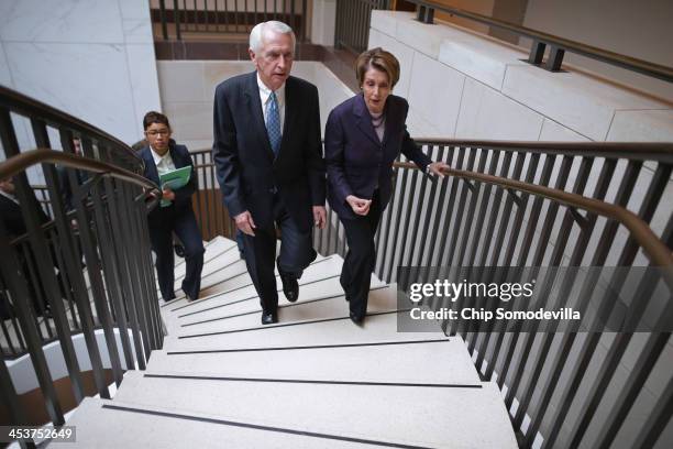 House Minority Leader Nancy Pelosi talks with Kentucky Governor Steve Beshear after a caucus meeting in the Capitol Visitors Center December 5, 2013...