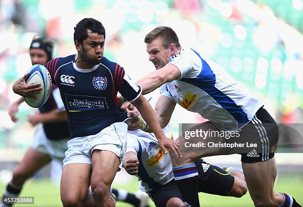 Rocky Khan of Auckland is tackled by Jaike Carter of NSW Waratahs during the Cup Semi-Final match between Auckland and NSW Waratahs during the World...