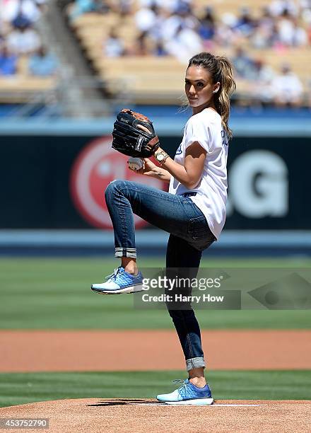 Jessica Alba throws out the ceremonial first pitch before the game between the Milwaukee Brewers and the Los Angeles Dodgers at Dodger Stadium on...