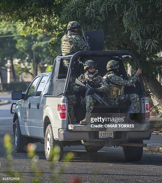 Mexican marines patrol the streets of the Lazaro Cardenas port, one of the biggest of the country, in Michoacan state, mexico on December 02, 2013....