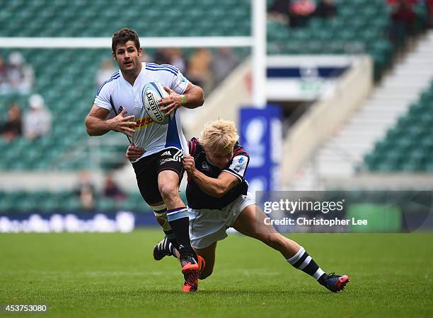 Harry Jones of Waratahs is tackled by Mitch Kiarpik of Auckland during the Cup Semi-Final match between Auckland and NSW Waratahs during the World...