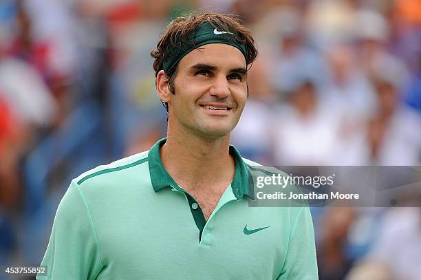 Roger Federer of Switzerland reacts as the match point is reviewed during a final match against David Ferrer of Spain on day 9 of the Western &...