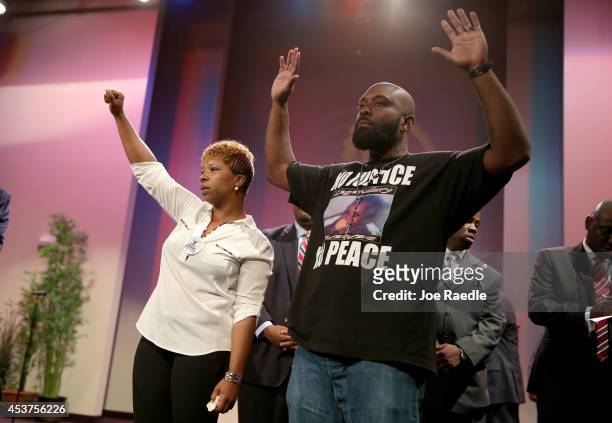 Lesley McSpadden and Michael Brown, the parents of slain 18-year-old Michael Brown, acknowledge a crowd during an event at the Greater Grace Church...