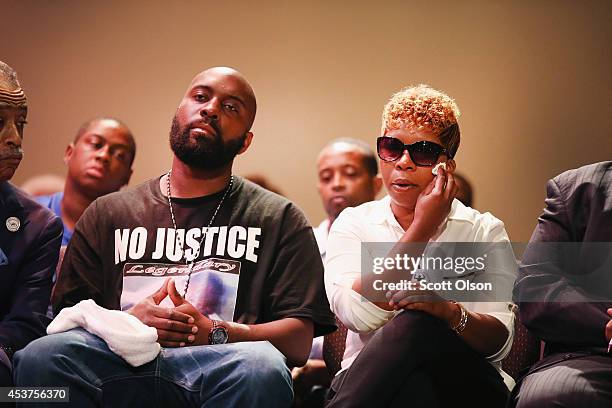 Michael Brown Sr. And Lesley McSpadden, the parents of slain teenager Michael Brown, attend a rally at Greater Grace Church on August 17, 2014 in...