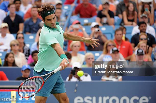 Roger Federer of Switzerland returns to David Ferrer of Spain during a final match on day 9 of the Western & Southern Open at the Linder Family...