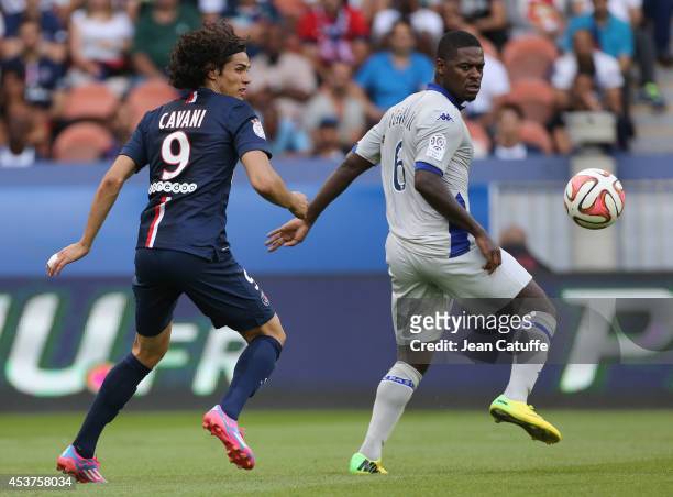 Edinson Cavani of PSG and Romaric N'Dri of Bastia in action during the French Ligue 1 match between Paris Saint Germain FC and SC Bastia at Parc des...
