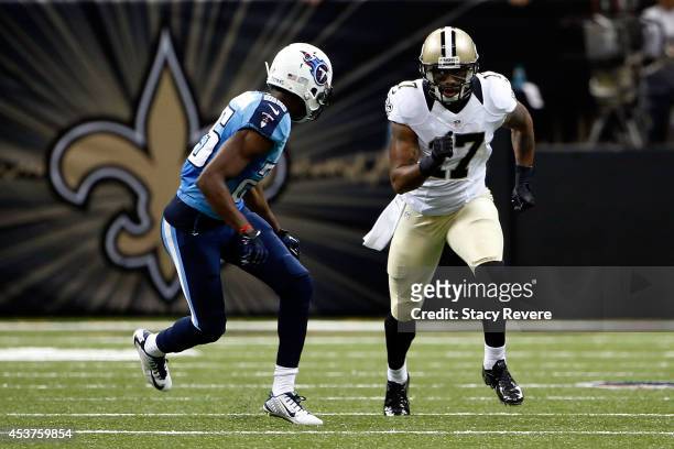 Robert Meachem of the New Orleans Saints runs a pass route against Blidi Wreh-Wilson of the Tennessee Titans during a preseason game at the...