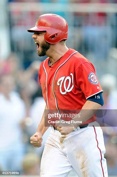 Kevin Frandsen of the Washington Nationals celebrates after scoring in the seventh inning against the Pittsburgh Pirates at Nationals Park on August...