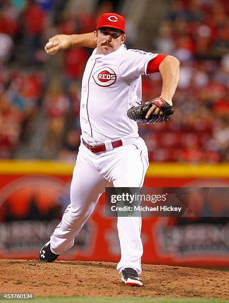 Sam LeCure of the Cincinnati Reds pitches during the game against the Miami Marlins at Great American Ball Park on Aug 9, 2014 in Cincinnati, Ohio.