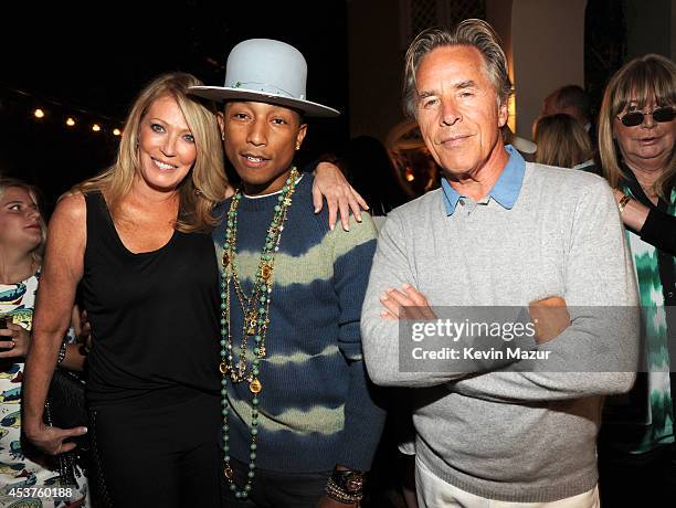 Pharrell Williams and Don Johnson attend Apollo in the Hamptons at The Creeks on August 16, 2014 in East Hampton, New York.