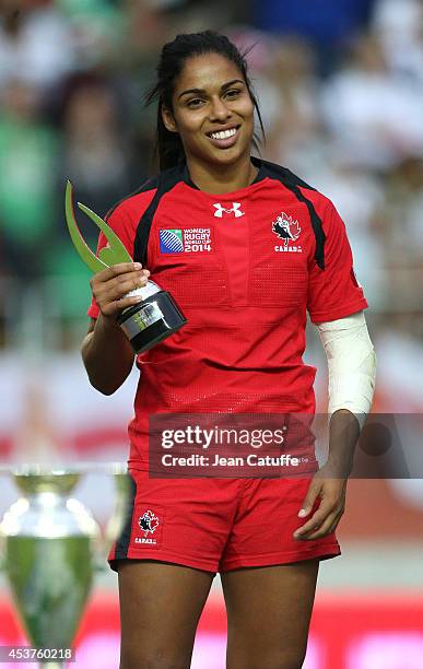 Magali Harvey of Canada receives the award of Best woman rugby player of the year after the IRB Women's Rugby World Cup 2014 Final between England...