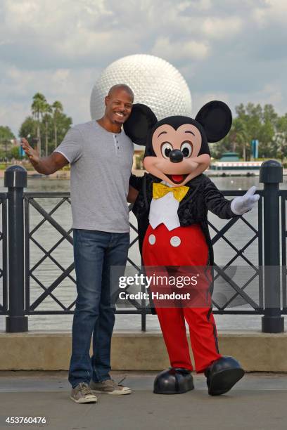 In this handout photo provided by Disney Parks, Writer/Director Keenen Ivory Wayans poses with Mickey Mouse in the Epcot theme park at the Walt...