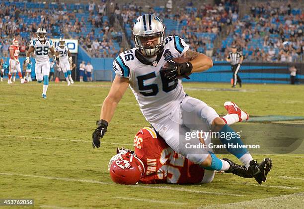 Klein of the Carolina Panthers is tackled by Cyrus Gray of the Kansas City Chiefs after returning an interception at Bank of America Stadium on...