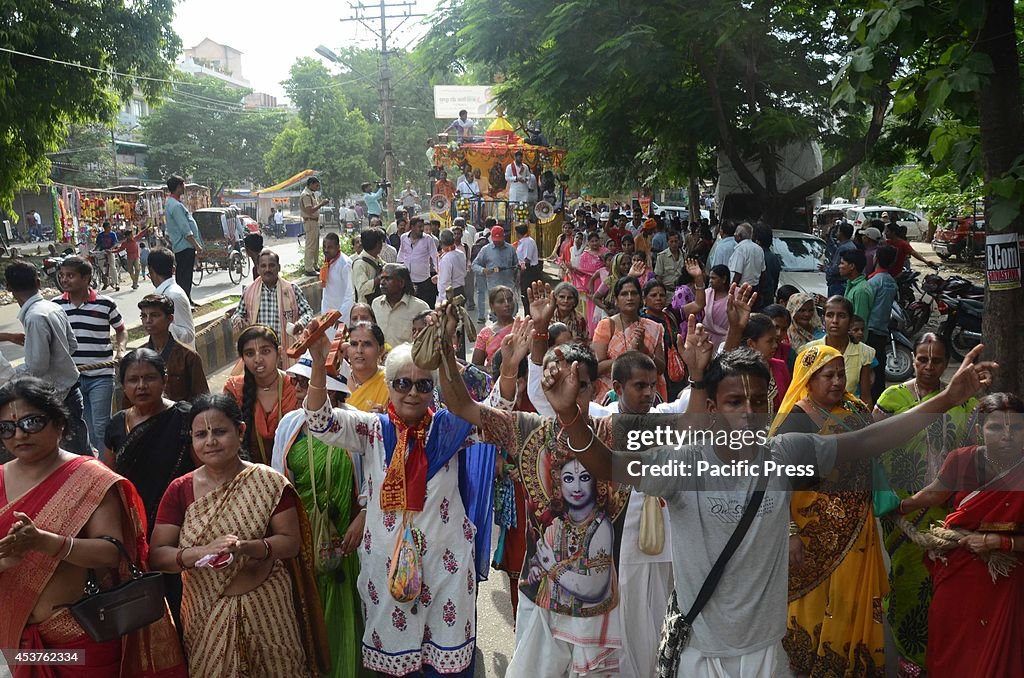 Devotees dance as they participating in a "Shobha Yatra"...